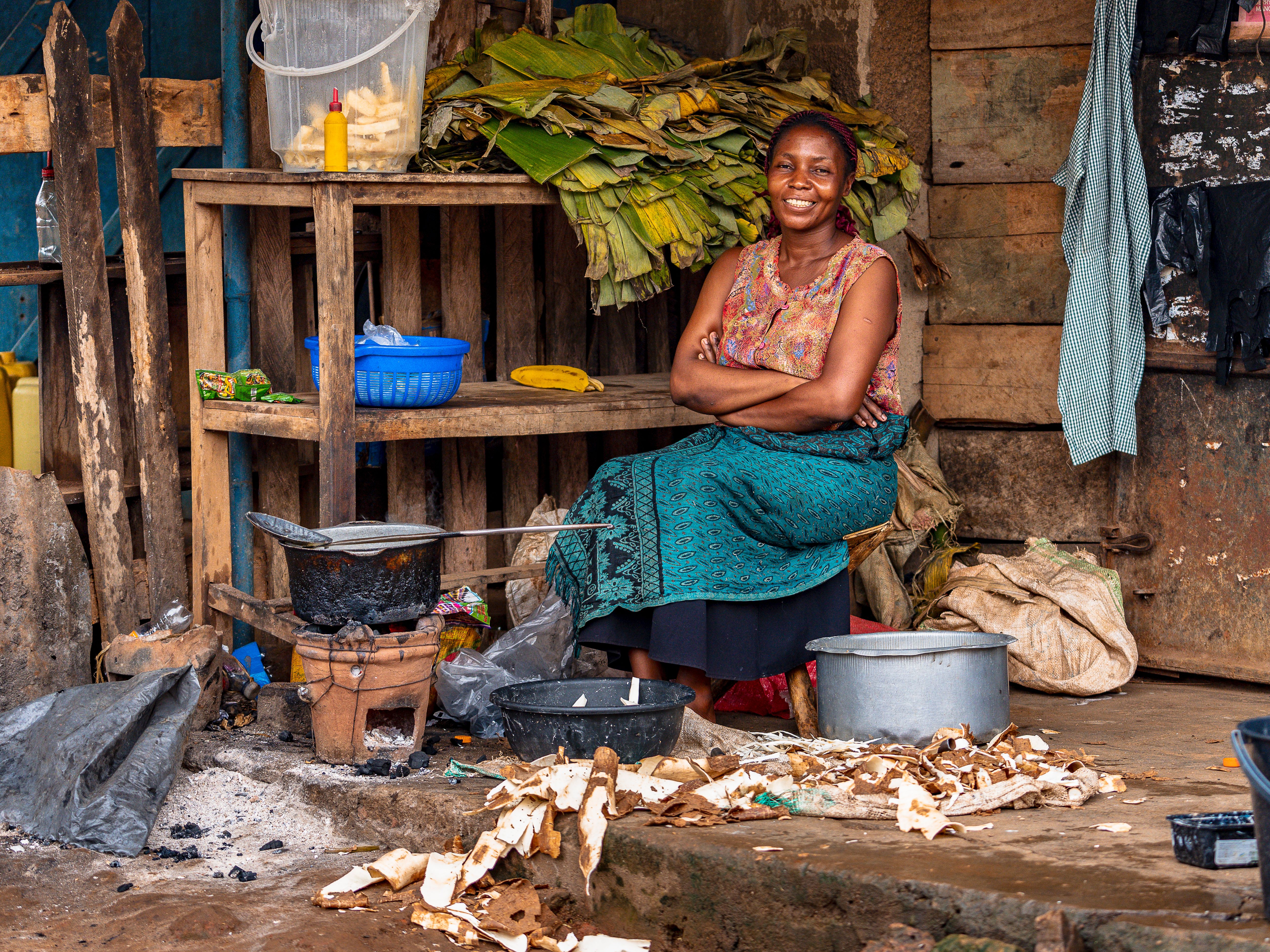 Woman sitting in an outdoor market setting